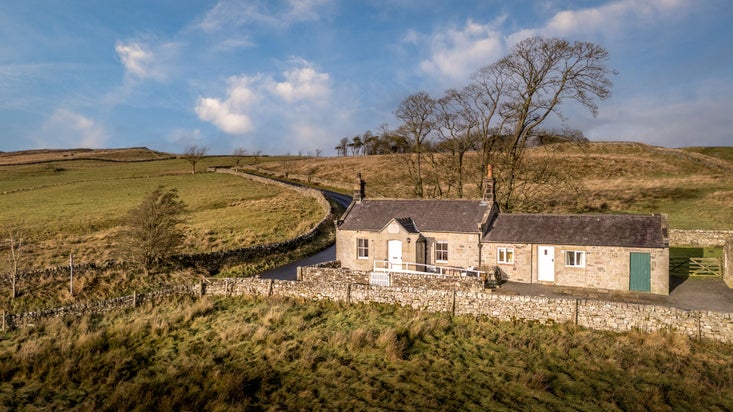 Peel Cottage, a single storey holiday cottage, part-way up a hill at the edge of Northumberland National Park, Northumberland